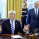 Donald Trump in the Oval Office on Friday showing how big the fish was that voted against his healthcare bill, completely destroying it singlehandedly (Photo by Olivier Douliery-Pool/Getty Images)